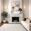 Luxury hand-knotted rug in ivory with scattered gold fleck pattern inspired by mineral fragments, styled in an elegant interior with chandelier, fireplace and brass accents, showcasing Northwest 35 craftsmanship.​